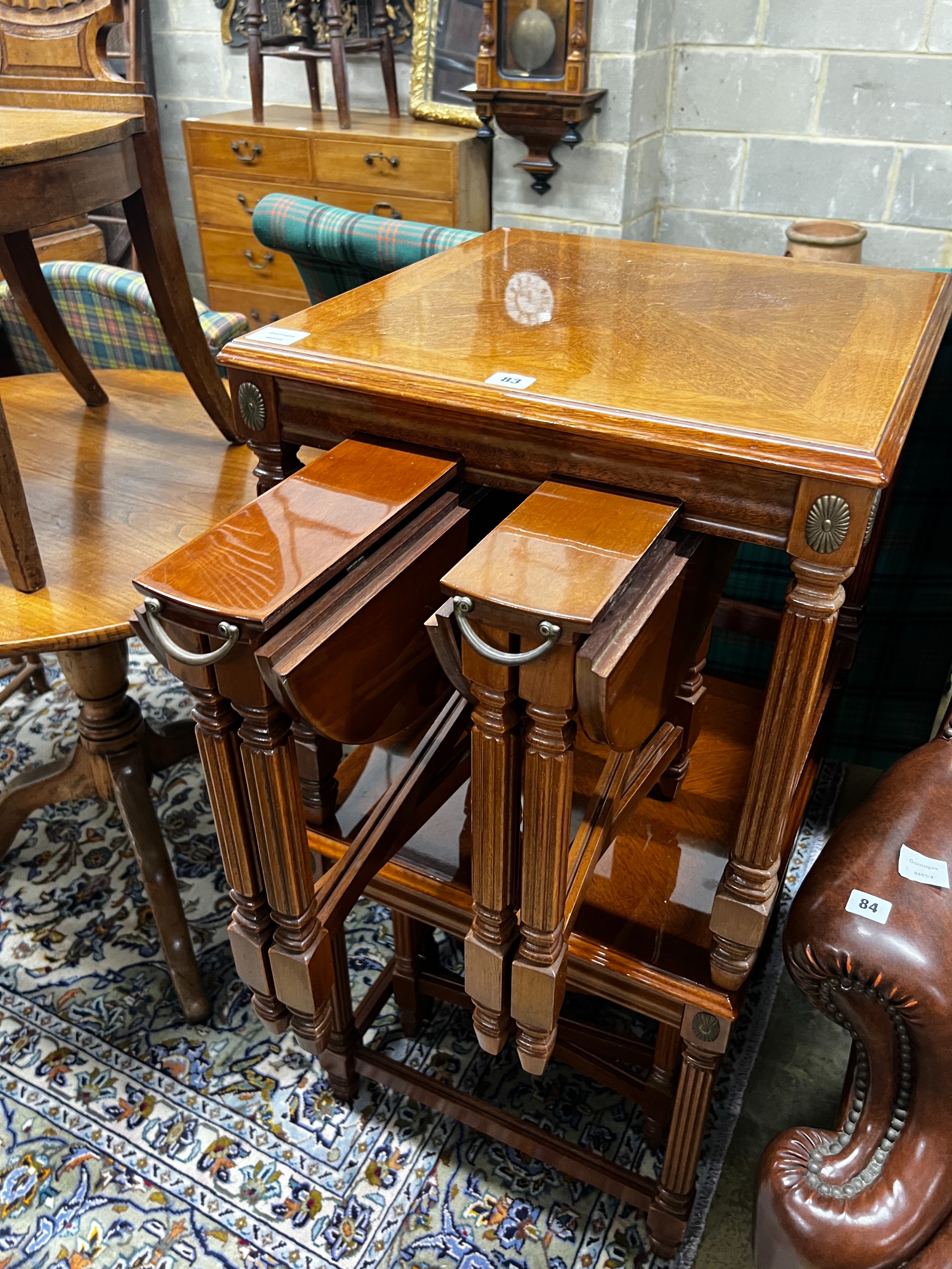 A pair of square reproduction walnut nests of tables, width 51cm, height 53cm